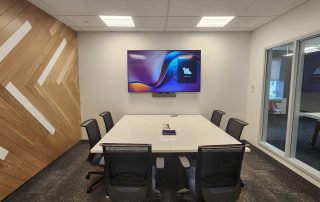 Small Conference Room with table and chairs, decorative wood accent wall
