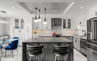 View of high-end contemporary condo open kitchen and dining