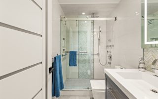 View of high-end contemporary condo spa-like bathroom