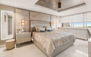 View of high-end contemporary condo primary bedroom